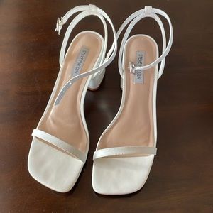 Women’s Steve Madden chunky white open toe heels.